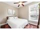 Comfortable bedroom with natural light, a ceiling fan, and a cozy rug at 1331 Osceola St, Denver, CO 80204