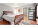 Cozy bedroom featuring a wood bed frame, hardwood floors, and stylish decor at 1331 Osceola St, Denver, CO 80204