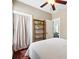 Bedroom with a ladder shelf, a closet with a curtain, and a window view at 1331 Osceola St, Denver, CO 80204