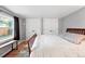 Bedroom featuring a window and two closets at 1331 Osceola St, Denver, CO 80204