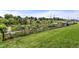 Well maintained community garden with raised beds, greenery, shed, and beautiful landscaping on a sunny day at 1331 Osceola St, Denver, CO 80204