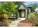 Charming home with an inviting front porch, beautiful landscaping, and a well-maintained exterior at 1331 Osceola St, Denver, CO 80204