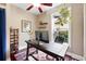 Functional home office featuring a large desk, shelving, and natural light at 1331 Osceola St, Denver, CO 80204