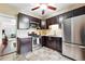 Well-equipped kitchen with stainless steel appliances and dark wood cabinetry at 1331 Osceola St, Denver, CO 80204