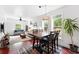 Open-concept living and dining area with hardwood floors and plenty of natural light at 1331 Osceola St, Denver, CO 80204