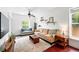 Inviting living room with a ceiling fan, comfortable seating, and a vintage-style rug at 1331 Osceola St, Denver, CO 80204