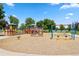 Colorful community playground with various play structures, swings, and a spring rider for children at 1331 Osceola St, Denver, CO 80204