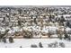 Winter aerial view of a residential area, highlighting snow-covered rooftops and community layout at 6366 Nassau Ct, Highlands Ranch, CO 80130