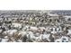 Scenic aerial view of a snow-covered residential community, showcasing the neighborhood layout and winter landscape at 6366 Nassau Ct, Highlands Ranch, CO 80130