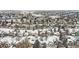 Aerial view of a snow-covered neighborhood with houses, trees, and roadways at 6366 Nassau Ct, Highlands Ranch, CO 80130