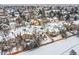 Overhead view of a neighborhood in winter, featuring snow-covered homes and landscape details at 6366 Nassau Ct, Highlands Ranch, CO 80130