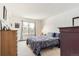 Cozy bedroom with neutral carpet and ample natural light from a good-sized window at 6366 Nassau Ct, Highlands Ranch, CO 80130