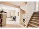 Hallway featuring carpet stairs, an office area, and a mirror at 6366 Nassau Ct, Highlands Ranch, CO 80130