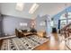 Bright living room with vaulted ceilings, skylights, hardwood floors and modern decor at 6366 Nassau Ct, Highlands Ranch, CO 80130