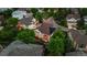 Aerial view of home with solar panels, lush landscaping, mature trees, and neighborhood streets at 6427 S Tibet St, Aurora, CO 80016