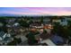 Dusk aerial view of a residential neighborhood with well-maintained houses and landscaping at 6427 S Tibet St, Aurora, CO 80016
