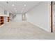 Spacious unfinished basement area with good lighting, open layout, and carpeting at 6427 S Tibet St, Aurora, CO 80016