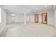 Spacious basement with carpet, columns, recessed lighting, windows, and closet at 6427 S Tibet St, Aurora, CO 80016