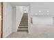 Finished basement stairs leading to a spacious and inviting living area at 6427 S Tibet St, Aurora, CO 80016