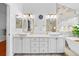 Spacious bathroom with double vanity, marble countertops, modern fixtures, and decorative lighting at 6427 S Tibet St, Aurora, CO 80016