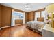 Comfortable bedroom with wood floors, a ceiling fan, and natural light at 6427 S Tibet St, Aurora, CO 80016