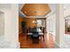 Elegant dining room featuring a stylish chandelier, large window, and beautiful hardwood floors at 6427 S Tibet St, Aurora, CO 80016