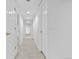 Carpeted hallway with white doors, white trim, and recessed lighting at 6427 S Tibet St, Aurora, CO 80016