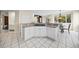 Bright eat-in kitchen with white cabinets, granite countertops, and stainless steel appliances at 6427 S Tibet St, Aurora, CO 80016