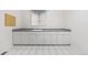 Laundry room with plenty of cabinet space and a large countertop for folding at 6427 S Tibet St, Aurora, CO 80016