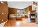 Inviting living room featuring a cozy fireplace, comfortable seating, and warm wood floors at 6427 S Tibet St, Aurora, CO 80016