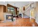 Spacious living room with a cozy fireplace, high ceilings, and natural light at 6427 S Tibet St, Aurora, CO 80016