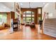 Spacious living room boasts high ceilings, large windows, a cozy fireplace, and gleaming hardwood floors at 6427 S Tibet St, Aurora, CO 80016