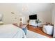 Spacious main bedroom with an ensuite bathroom and wood floors at 6427 S Tibet St, Aurora, CO 80016