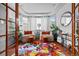 Bright sitting room with beautiful hardwood floors, plenty of light, and tastefully decorated interior at 6427 S Tibet St, Aurora, CO 80016