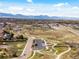 Aerial shot featuring a park, a parking lot, walking paths and roads at 6640 Grove St, Denver, CO 80221