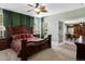 Bedroom with a distinctive wooden bed and a connecting door to an adjacent dining area at 6640 Grove St, Denver, CO 80221