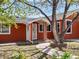 Inviting front entrance with a covered porch, and an accessible walkway at 6640 Grove St, Denver, CO 80221