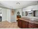 Open-concept kitchen with granite countertops, seamless connection to the dining and living areas at 6640 Grove St, Denver, CO 80221