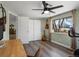 Bright home office featuring a ceiling fan, closet, and desk with large window letting in ample natural light at 6640 Grove St, Denver, CO 80221