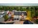 A modern two-story home features a two-car garage, outdoor living space, professional landscaping, and backyard privacy at 920 Neon Forest Cir, Longmont, CO 80504