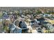 Charming blue single-Gathering home features solar panels, a driveway, a spacious yard, and mature trees at 920 Neon Forest Cir, Longmont, CO 80504
