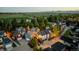 A serene aerial view of a residential neighborhood, showcasing well-maintained homes, lush greenery, and beautiful mountain views at 920 Neon Forest Cir, Longmont, CO 80504