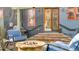 Charming back patio with outdoor seating, a fire pit, and access to the house at 920 Neon Forest Cir, Longmont, CO 80504