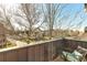 Balcony overlooking a quiet residential street with mature trees in the neighborhood at 920 Neon Forest Cir, Longmont, CO 80504