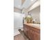 Updated bathroom featuring a vanity with storage, stylish mirror, and neutral color palette at 920 Neon Forest Cir, Longmont, CO 80504