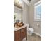 Cozy bathroom with an eye-catching vessel sink, modern fixtures, and tile flooring at 920 Neon Forest Cir, Longmont, CO 80504