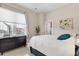 Bright bedroom with large window, modern dresser, and cozy bedding at 920 Neon Forest Cir, Longmont, CO 80504