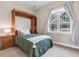 Cozy bedroom featuring a built-in Murphy bed and a sunny window with neighborhood views at 920 Neon Forest Cir, Longmont, CO 80504