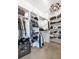 Spacious walk-in closet with custom shelving and organized storage solutions at 920 Neon Forest Cir, Longmont, CO 80504