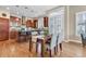 Inviting dining area with hardwood floors, comfortable seating, and a seamless flow to the kitchen at 920 Neon Forest Cir, Longmont, CO 80504